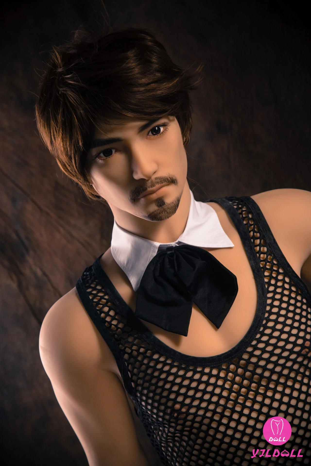 Andrew male doll wearing a mesh top and bow tie; manufacturer watermark retained